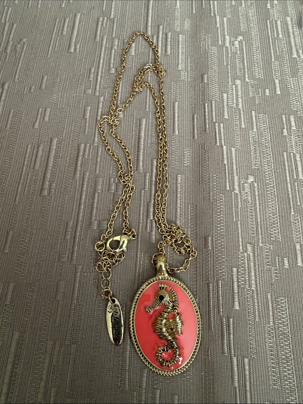 Plunder Gold-Tone Seahorse Pendant Necklace with Coral Pink Enamel
